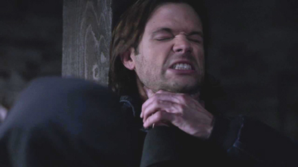 Agnes chokes Sam to stop him from reciting the exorcism. Agnes chokes Sam to stop him from reciting the exorcism.